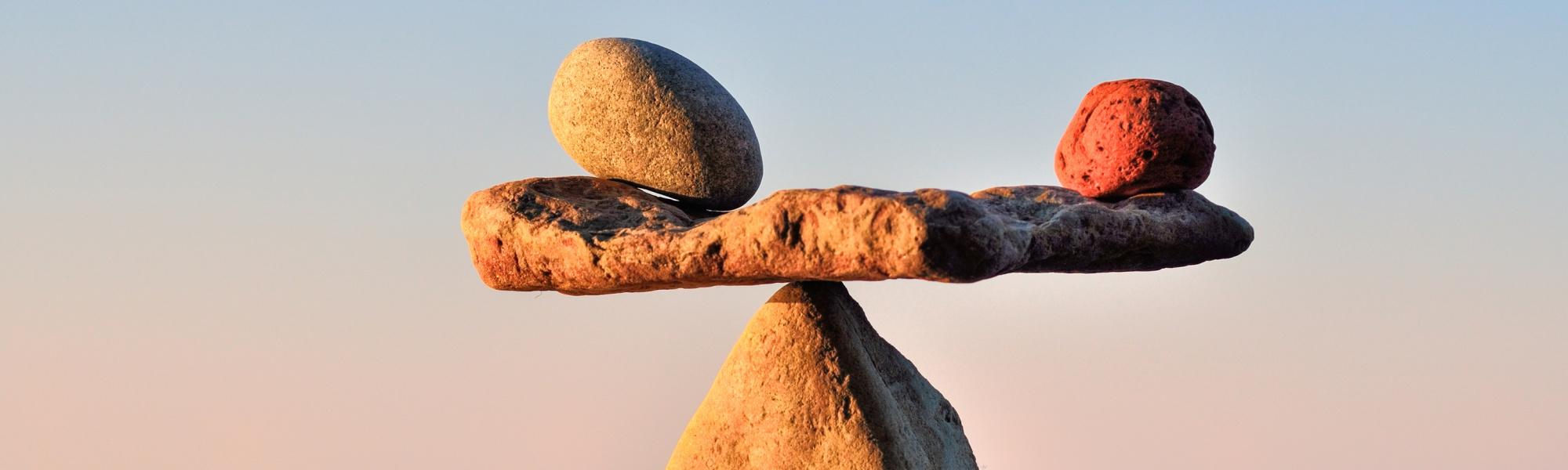 Image shows a sculpture made of balancing rocks.